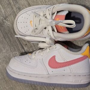 Nike White and Pink Sneakers with Classic Design